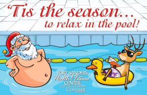 Fat Santa Claus wearing hat standing in pool with a reindeer floating in a rubber duck pool float